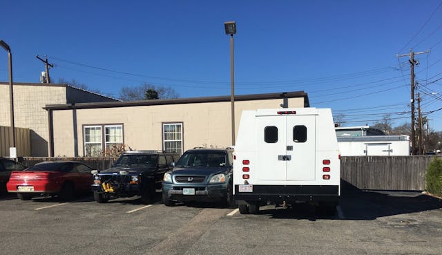 Random parking lot cars on sunny bluebird day