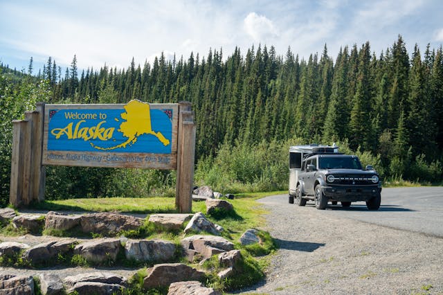 Bronco Airstream Alaska Road Trip front three quarter Alaska sign