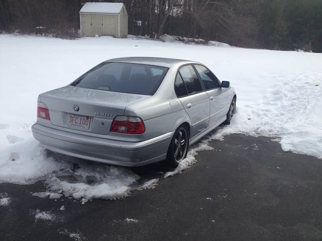 BMW 530i rear three quarter snow parked