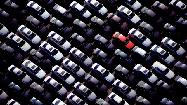 Red car in group aerial high angle