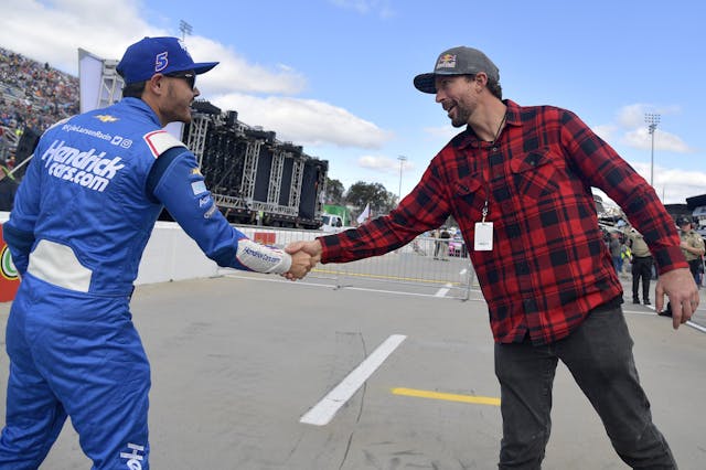 Travis Pastrana Kyle Larson shaking hands 2021 Martinsville Speedway