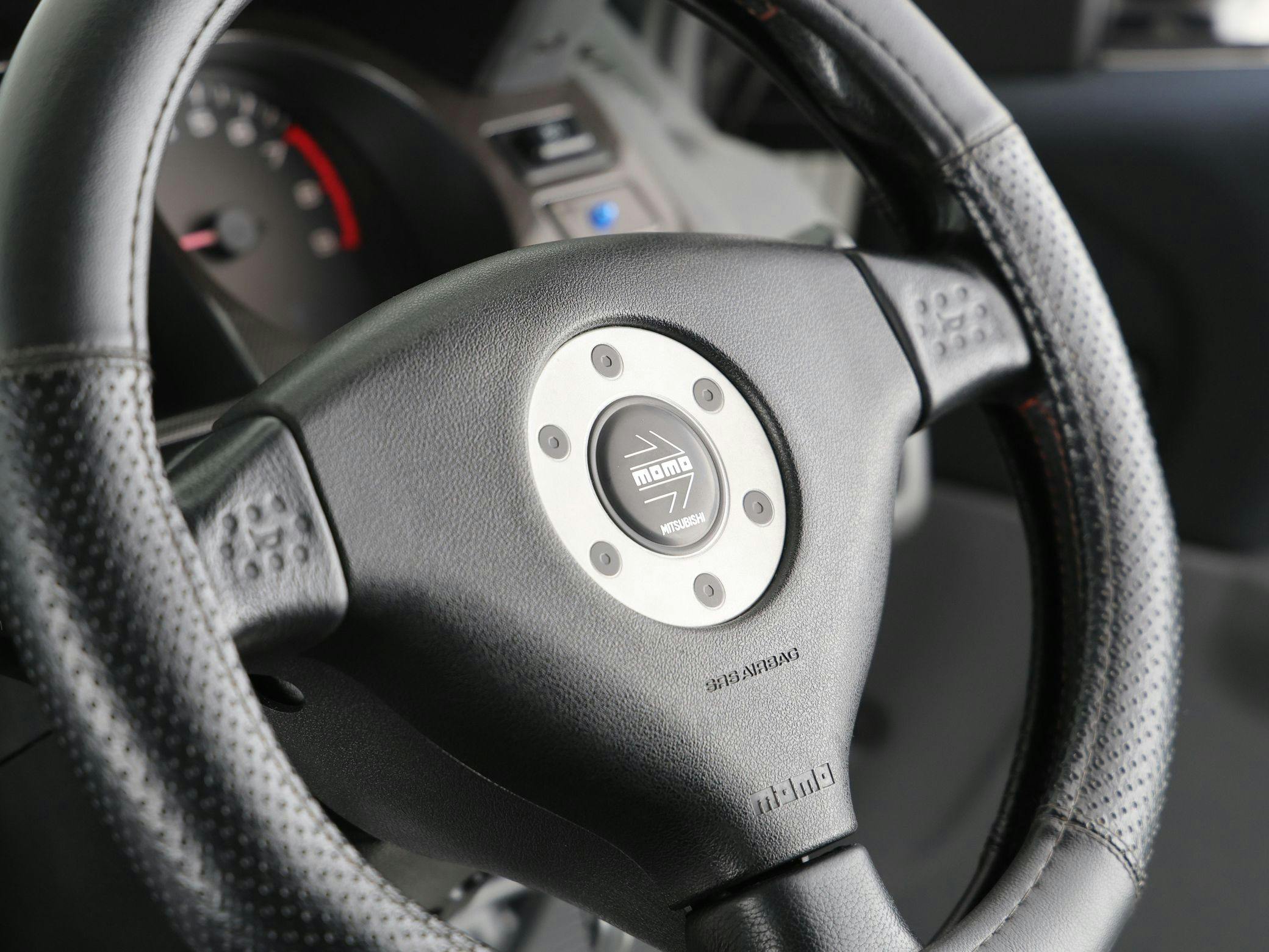 1998 Mitsubishi Pajero Evolution interior steering wheel closeup