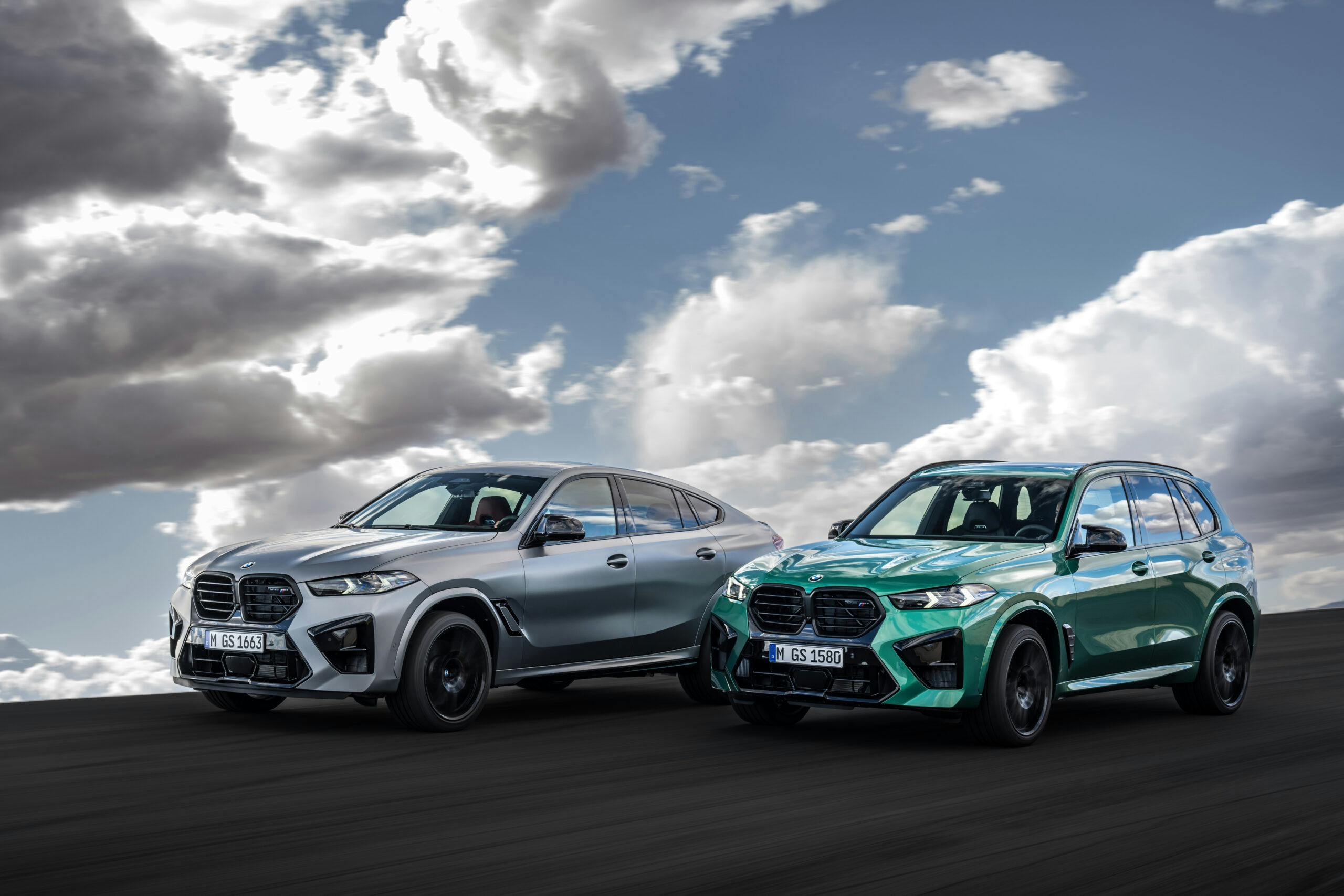 2024 BMW X5 M Competition and X6 M Competition pair driving front three quarter