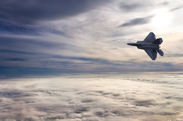 F22 Flying Above the Clouds