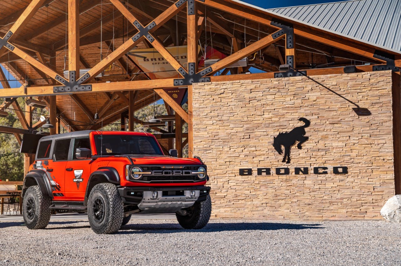 Ford Bronco Raptor Off-Roadeo exterior front three quarter by Bronco logo