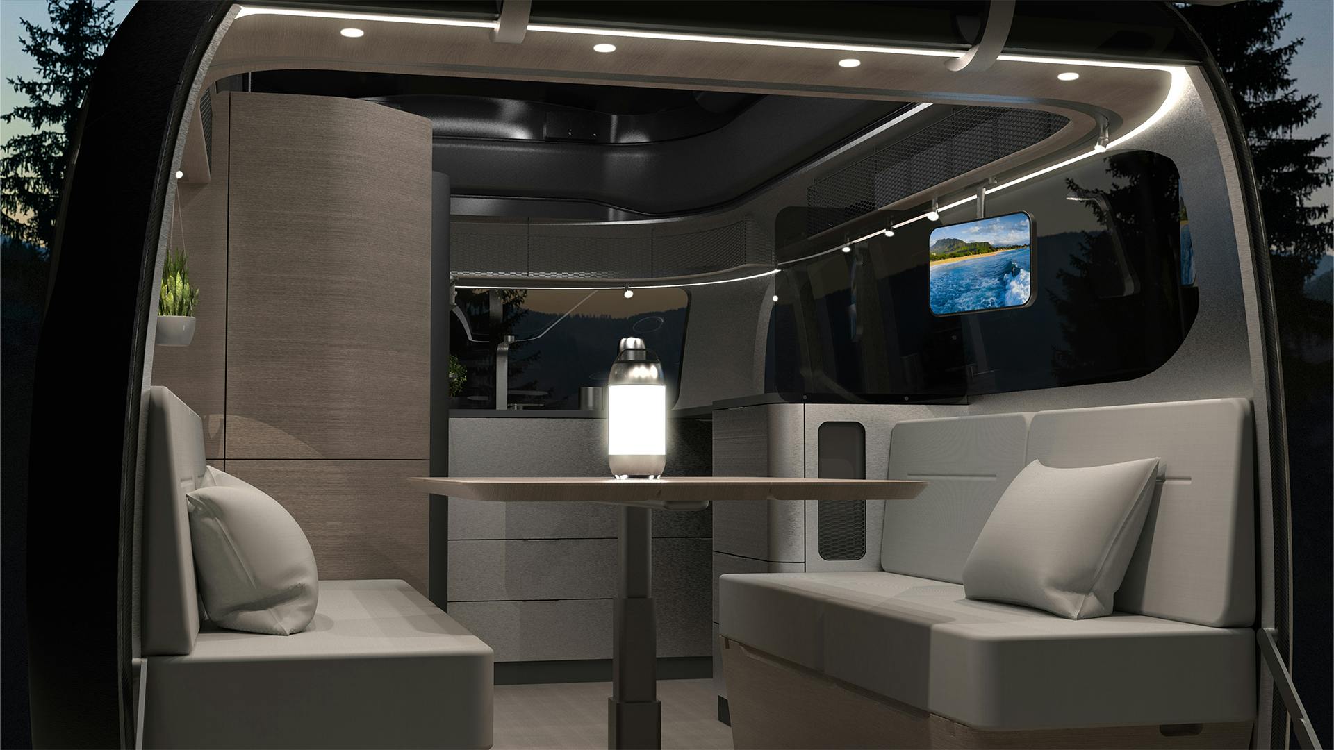 Airstream Porsche camper trailer interior modular lounge seats and table