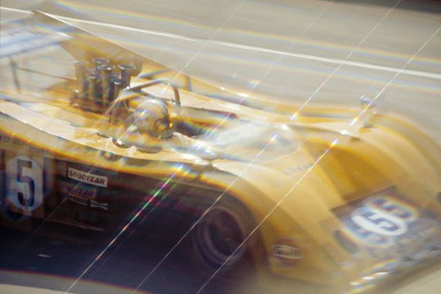 Denny Hulme in McLaren M20 Can Am race blur pan action