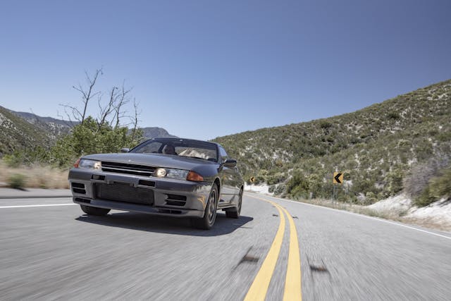 Nissan Skyline R32 GT-R front three quarter driving action