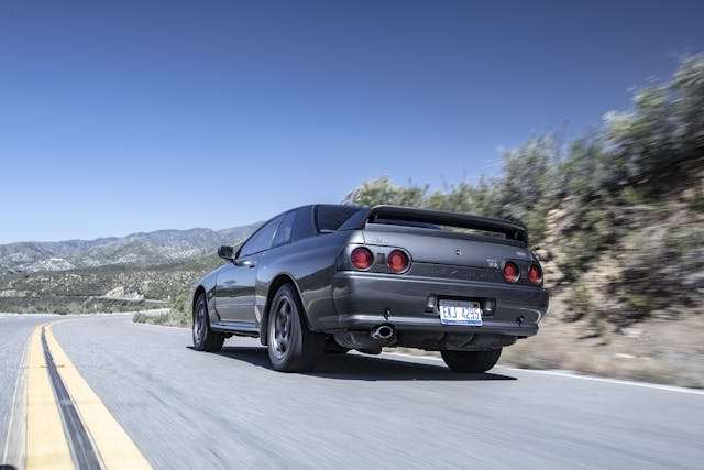 Nissan Skyline R32 GT-R rear three quarter driving action