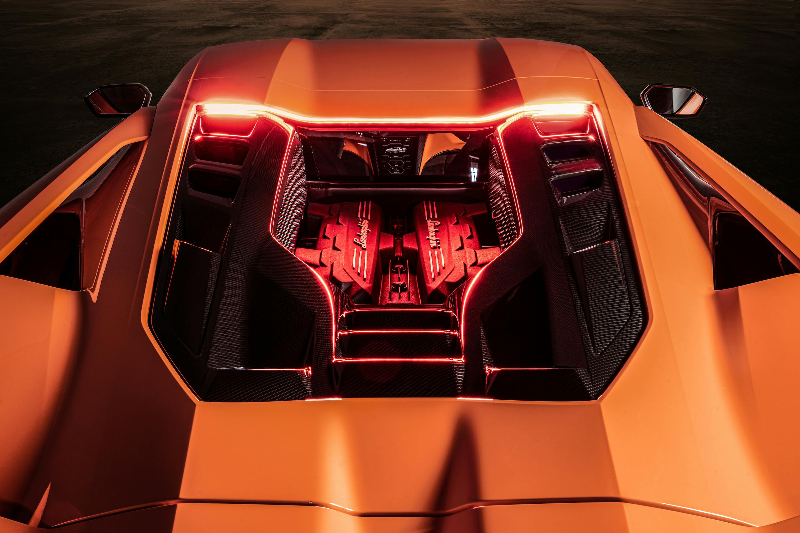 Lamborghini Revuelto plug in hybrid supercar high angle rear engine illumination