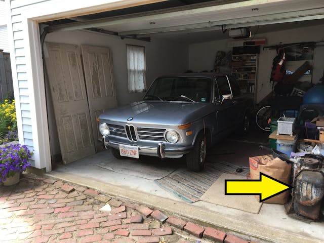 Old vintage BMW in garage engine block arrow