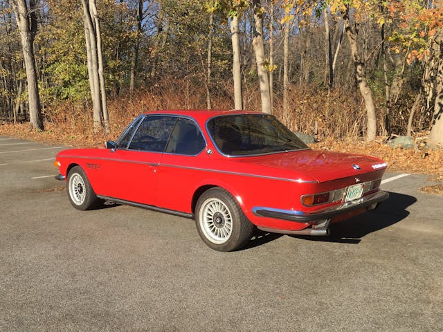 Old vintage BMW red coupe rear three quarter