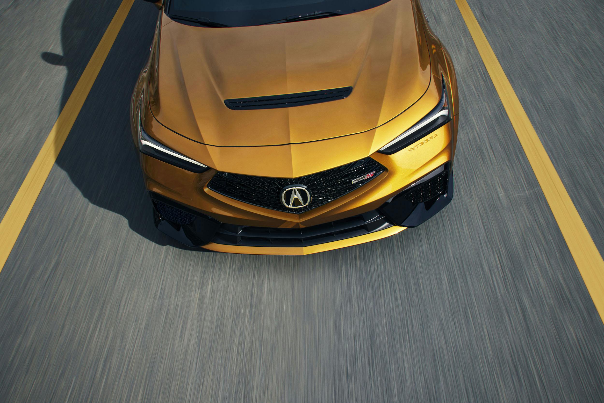 2024 Acura Integra Type S gold hood front end driving action road blur