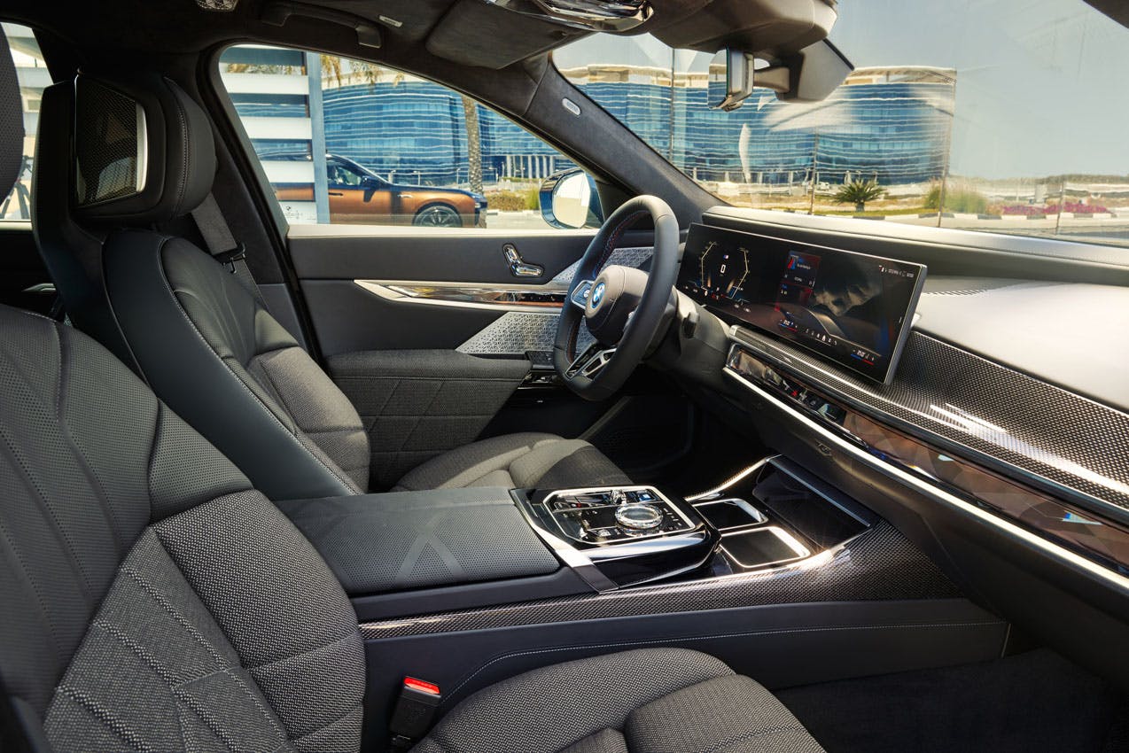 2024 BMW i7 M70 xDrive interior front cabin area through passenger door
