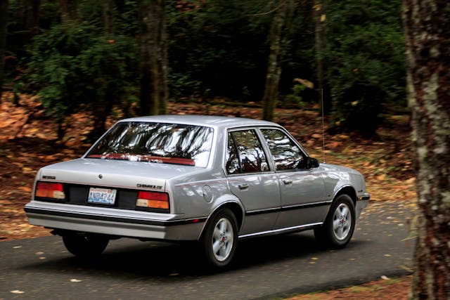 Chevrolet Cavalier rear three quarter driving action