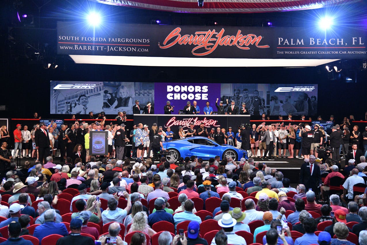 Chevrolet Corvette E-Ray VIN 001 Barrett-Jackson auction crowd shot far view with podium