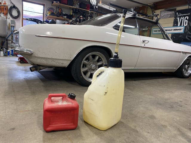 gas containers on garage floor corvair