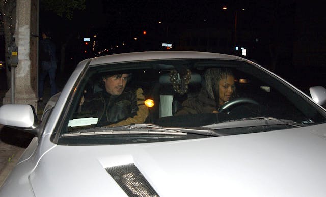 Janet Jackson aston martin vanquish behind the wheel