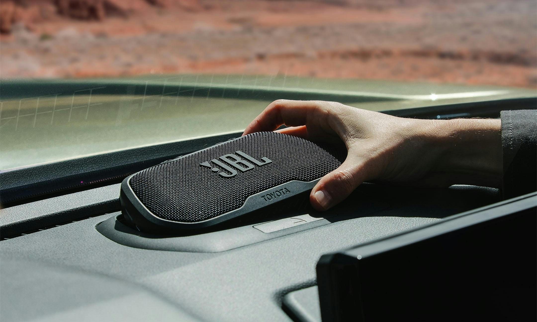 2024 Toyota Tacoma removable JBL bluetooth speaker being pulled out of dashboard