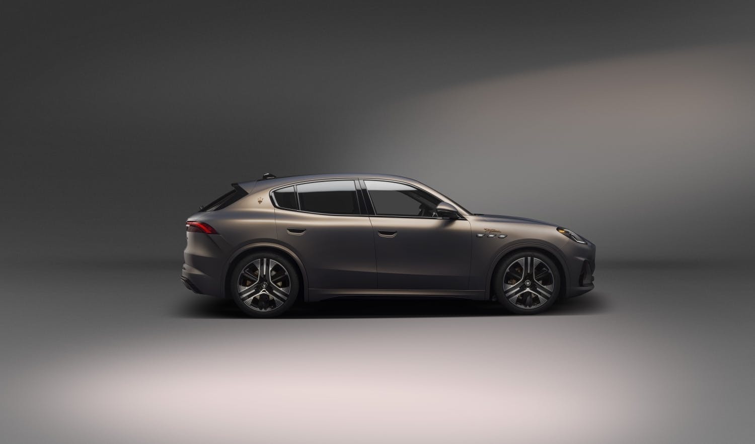 Maserati Grecale Folgore EV exterior side profile brown studio
