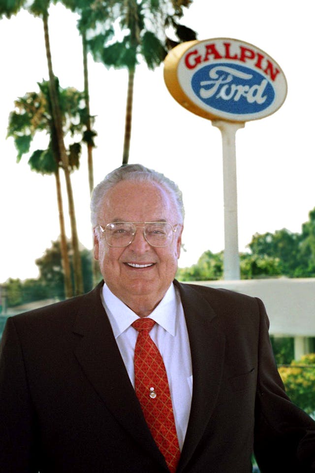 Bert Boeckmann in front of Galpin Ford sign