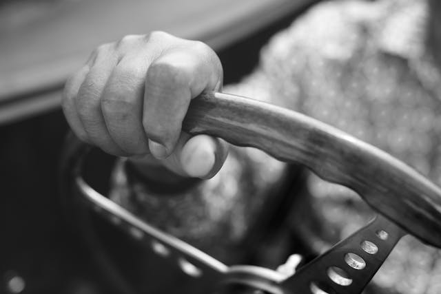 Herbie Hancock AC Cobra hand on wheel detail black white