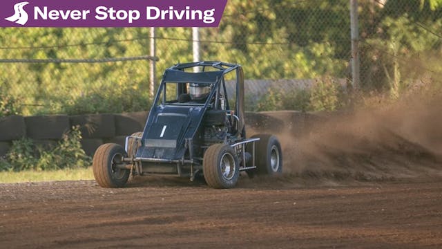 Sam Webster Micro sprint on dirt exterior front three quarter sliding Never Stop Driving lede bannered