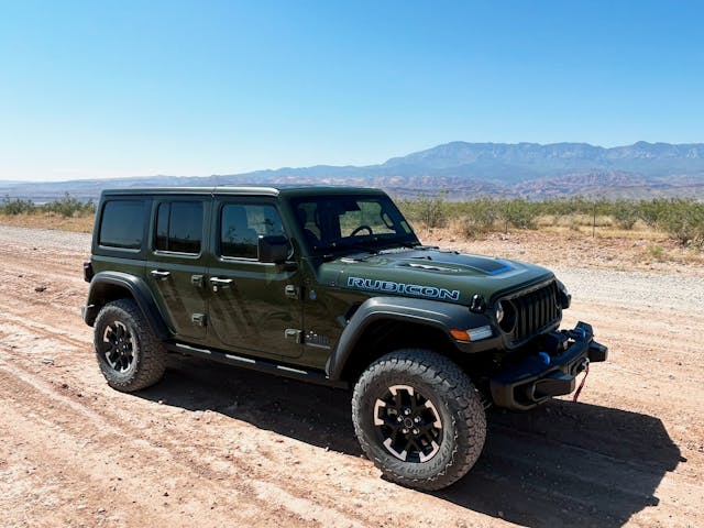 2024 Jeep Wrangler Rubicon 4xe exterior front three quarter on dirt road