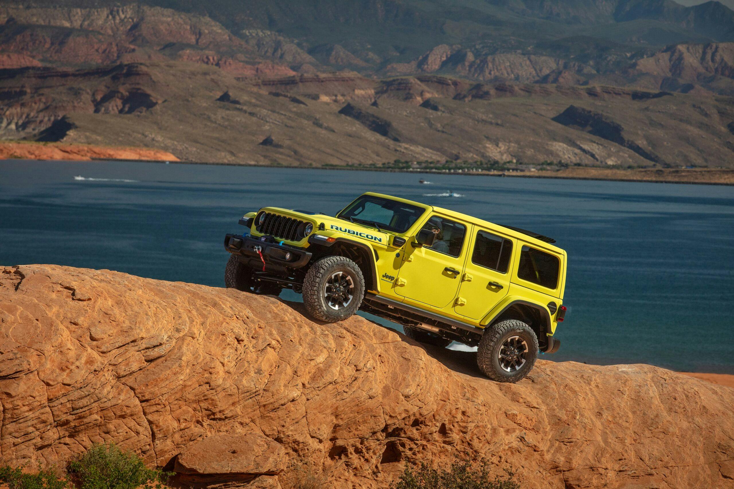 2024 Jeep Wrangler Rubicon 4xe exterior side profile climbing rocks yellow
