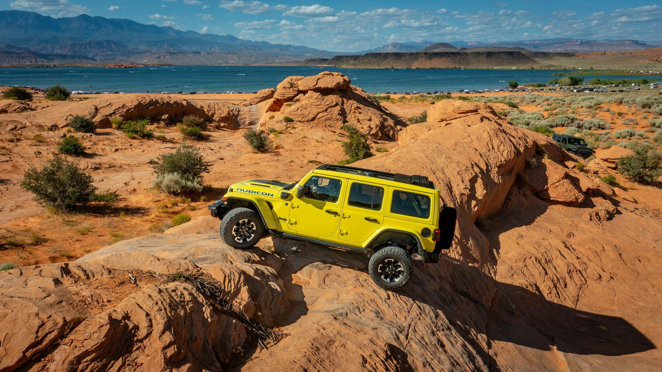 2024 Jeep Wrangler Rubicon 4xe exterior side profile climbing rocks suspension flex yellow