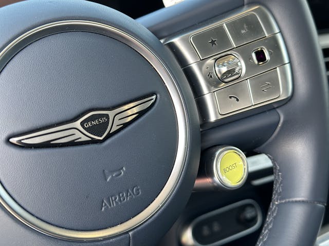 genesis steering wheel boost button