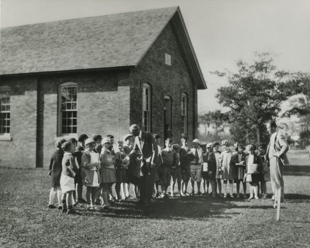 Henry Ford greets schoolchildren at formal dedication edison institute