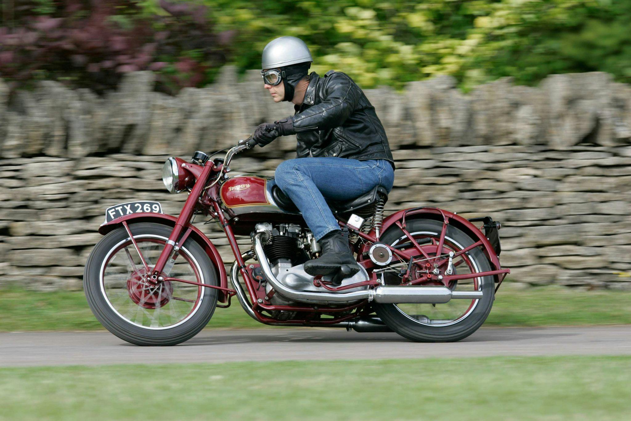 Triumph Speed Twin classic motorcycle riding action side profile