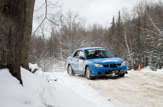 Team O'Neil rally school full stage rally Subaru Impreza front three quarter by tree