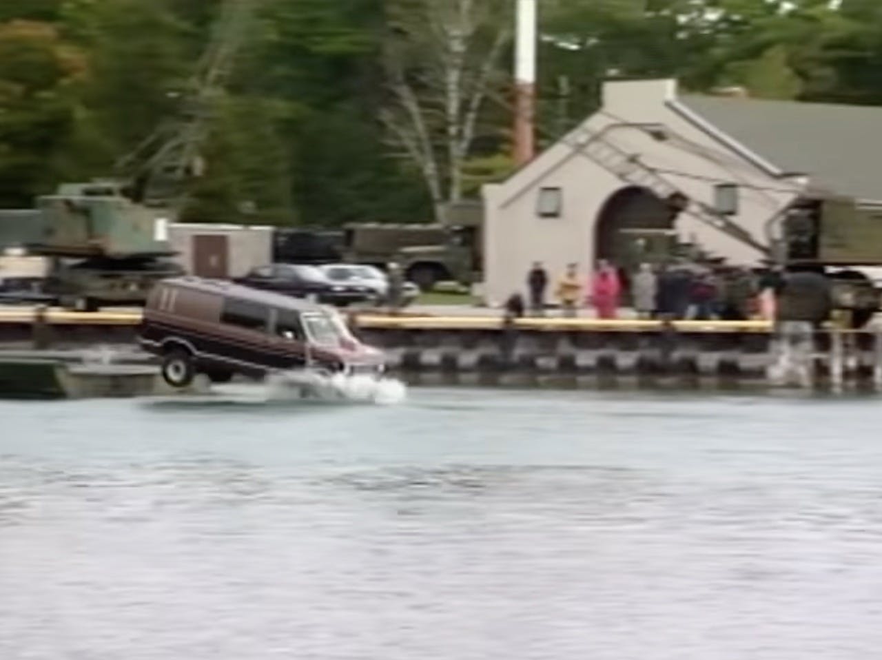 Accident reconstructionists drive a Ford van into a lake