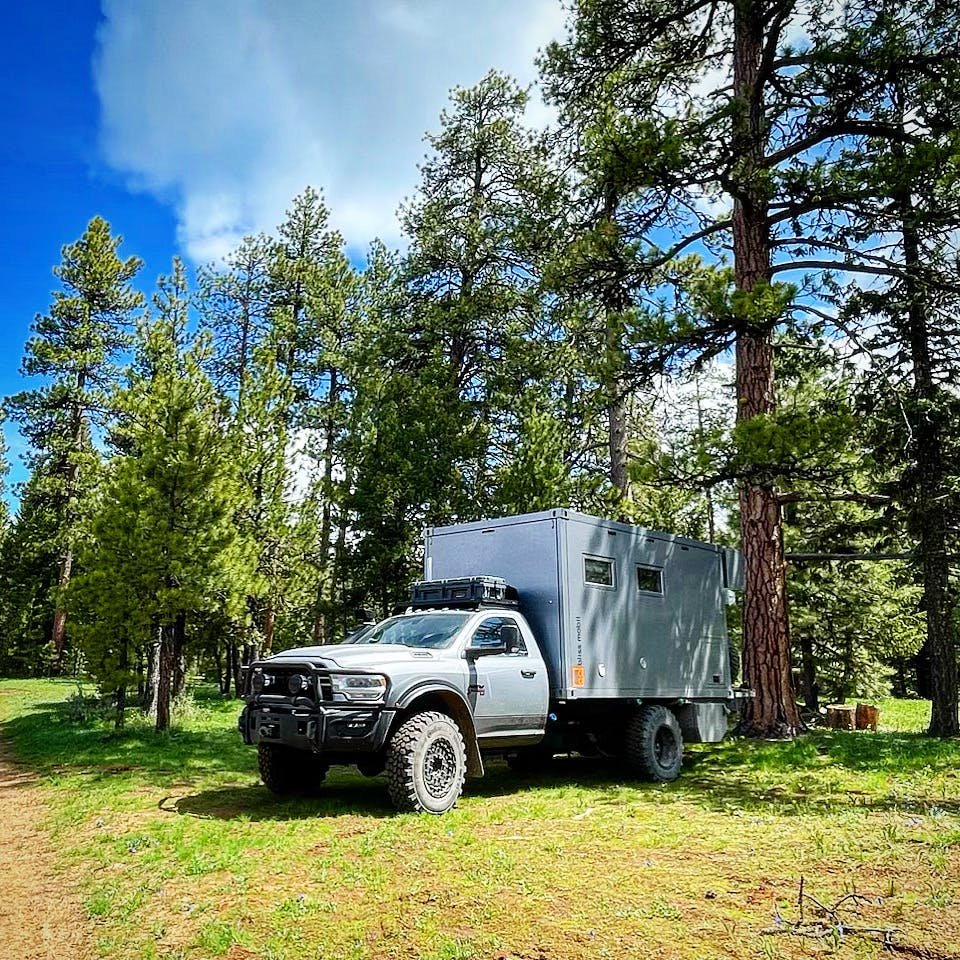AEV x Bliss Mobil Prospector XL 550 exterior front three quarter in woods