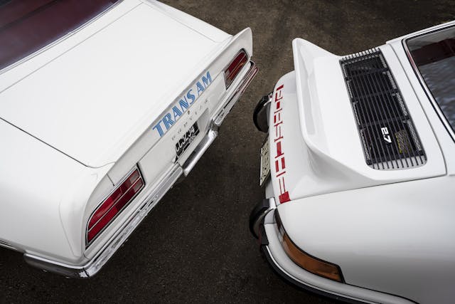 1973 Porsche 911 and Pontiac Trans Am tails high angle