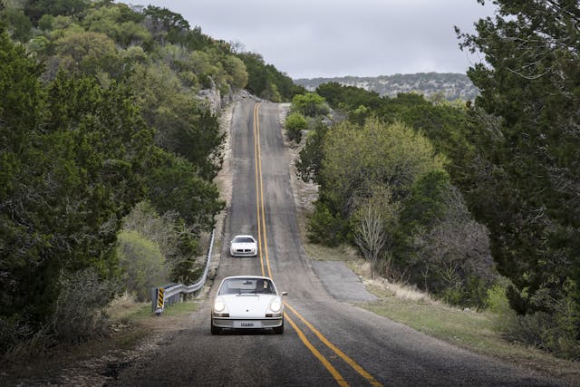 1973 Porsche 911 and Pontiac Trans Am fronts driving action