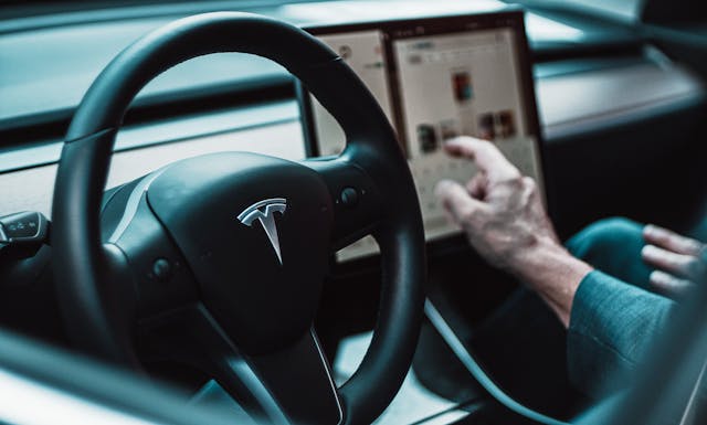 tesla touchscreen interior steering wheel logo