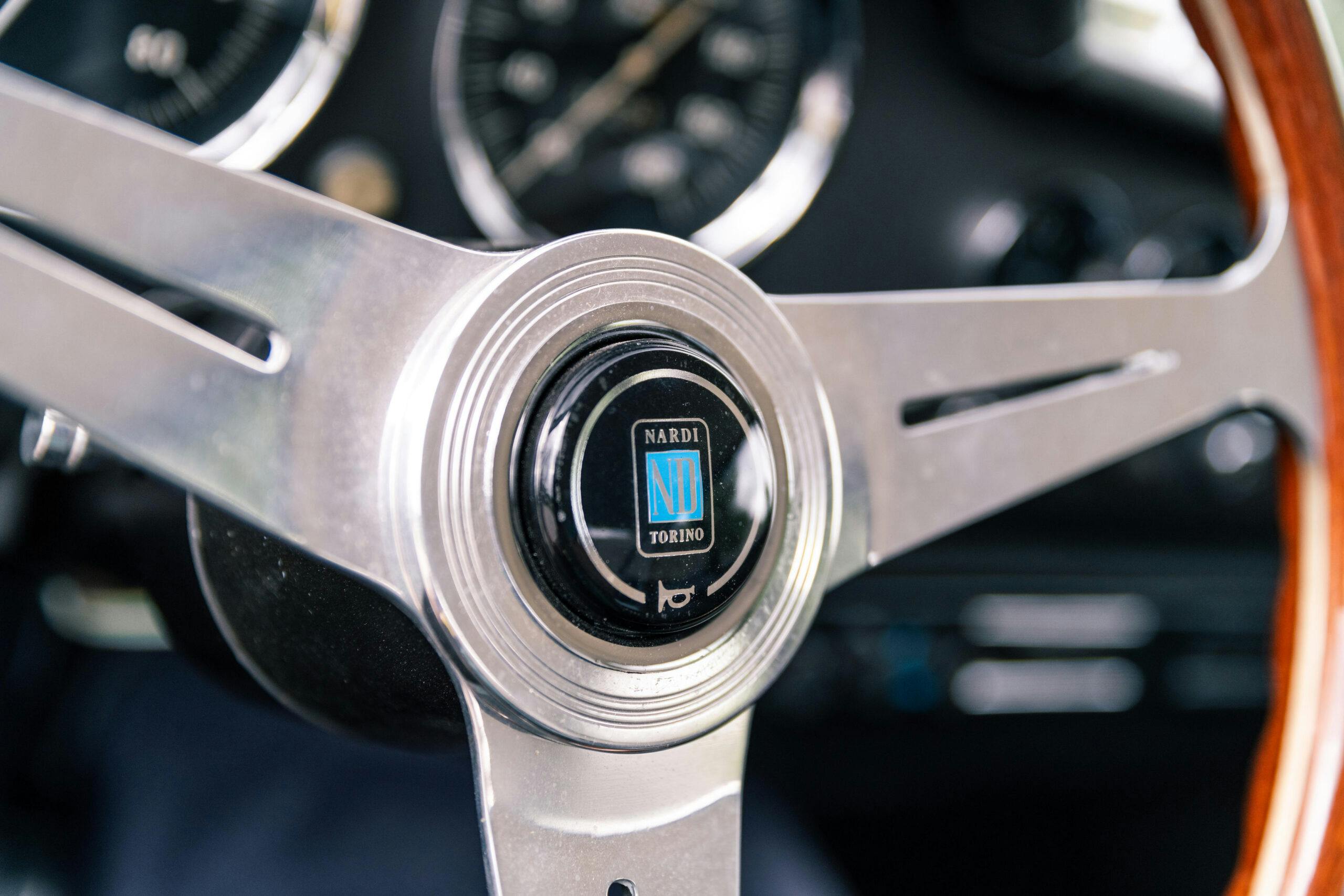 1965 Apollo GT interior steering wheel nardi closeup