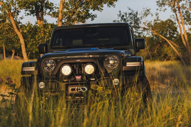2024 Jeep Wrangler Rubicon 4xe AEV Level II kit front end in tall grass