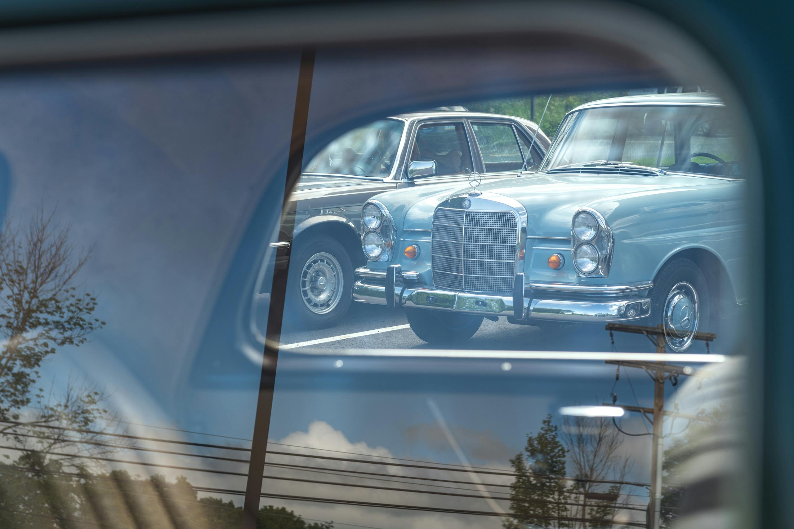 Jaime Kopchinski Mercedes Benz Expert Shop parking lot car through glass
