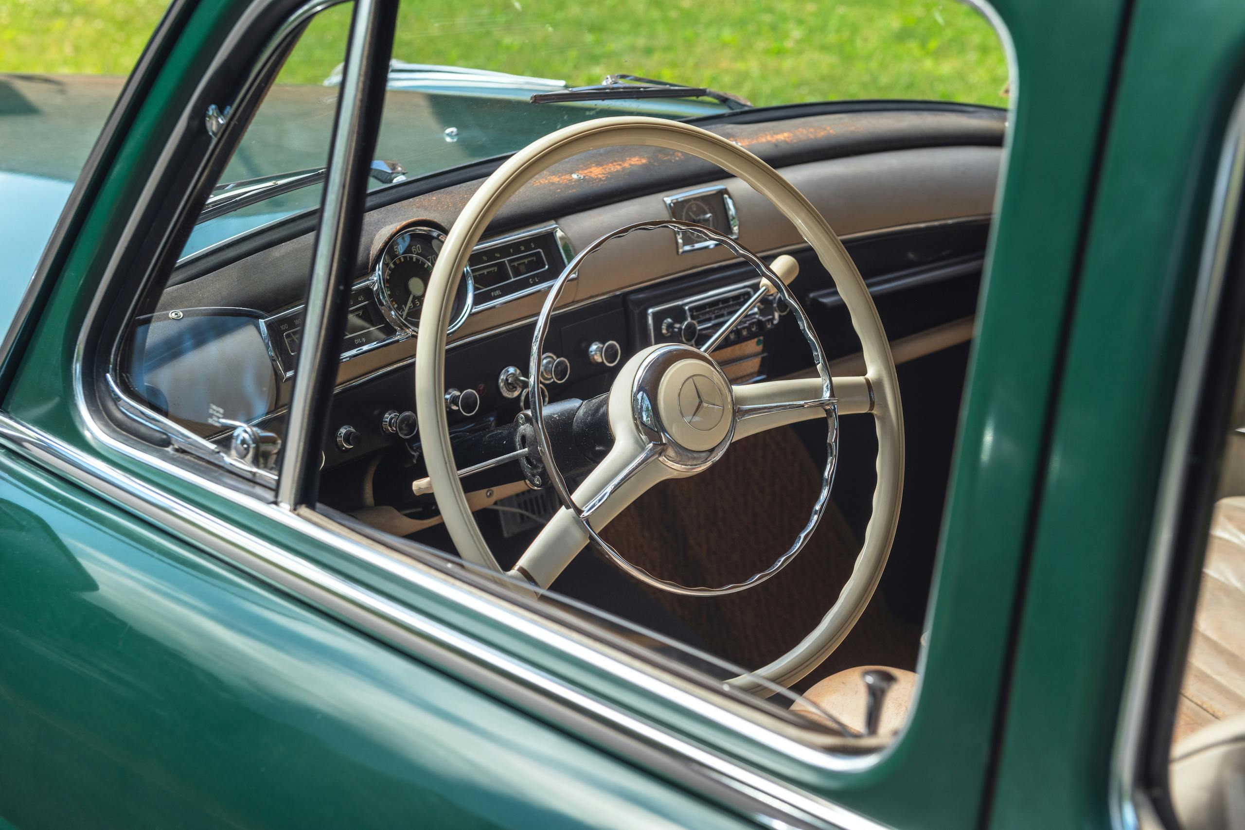 Jaime Kopchinski Mercedes Benz Expert Shop vintage benz wheel through window