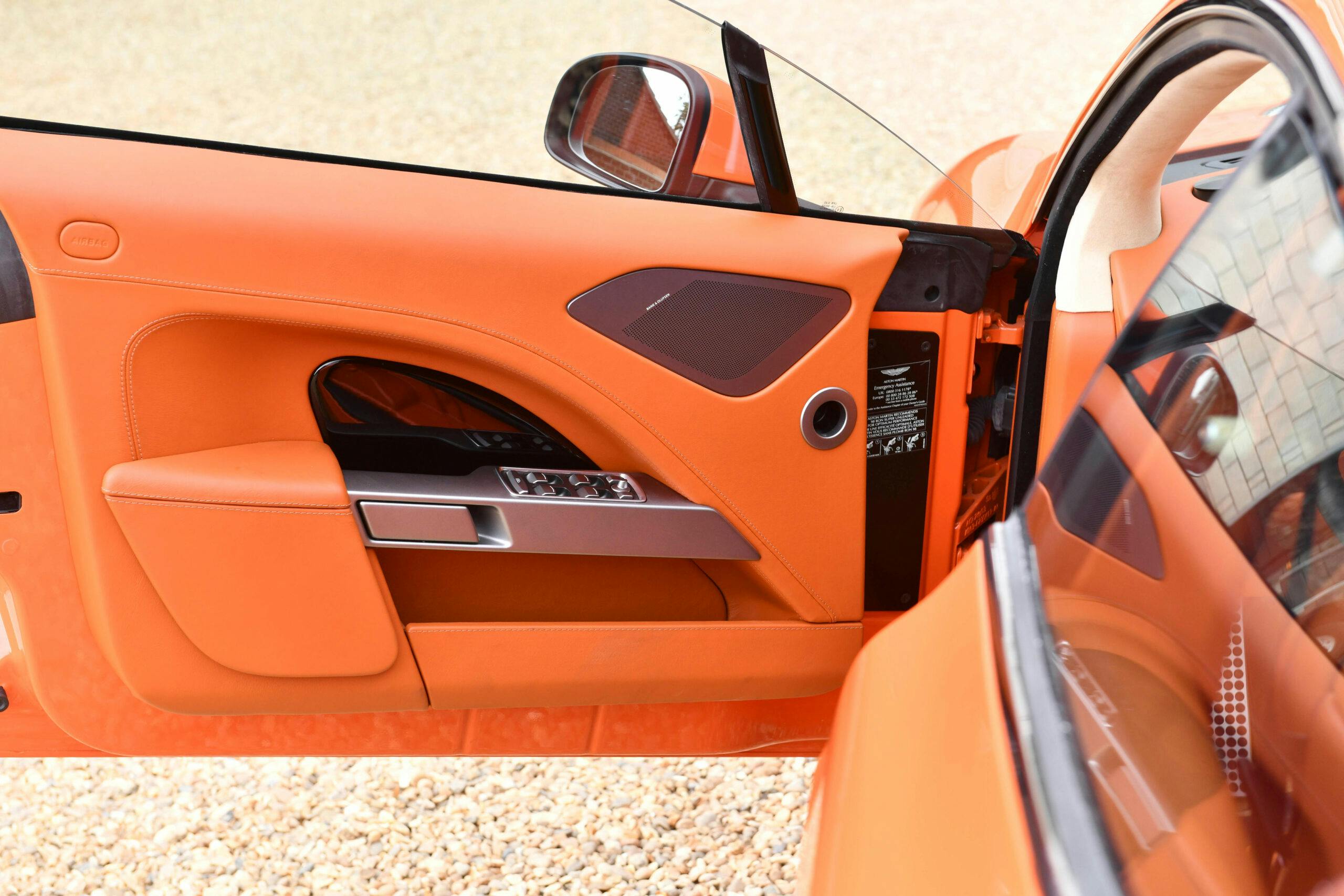 2010-Aston-Martin-Rapide orange interior door panel