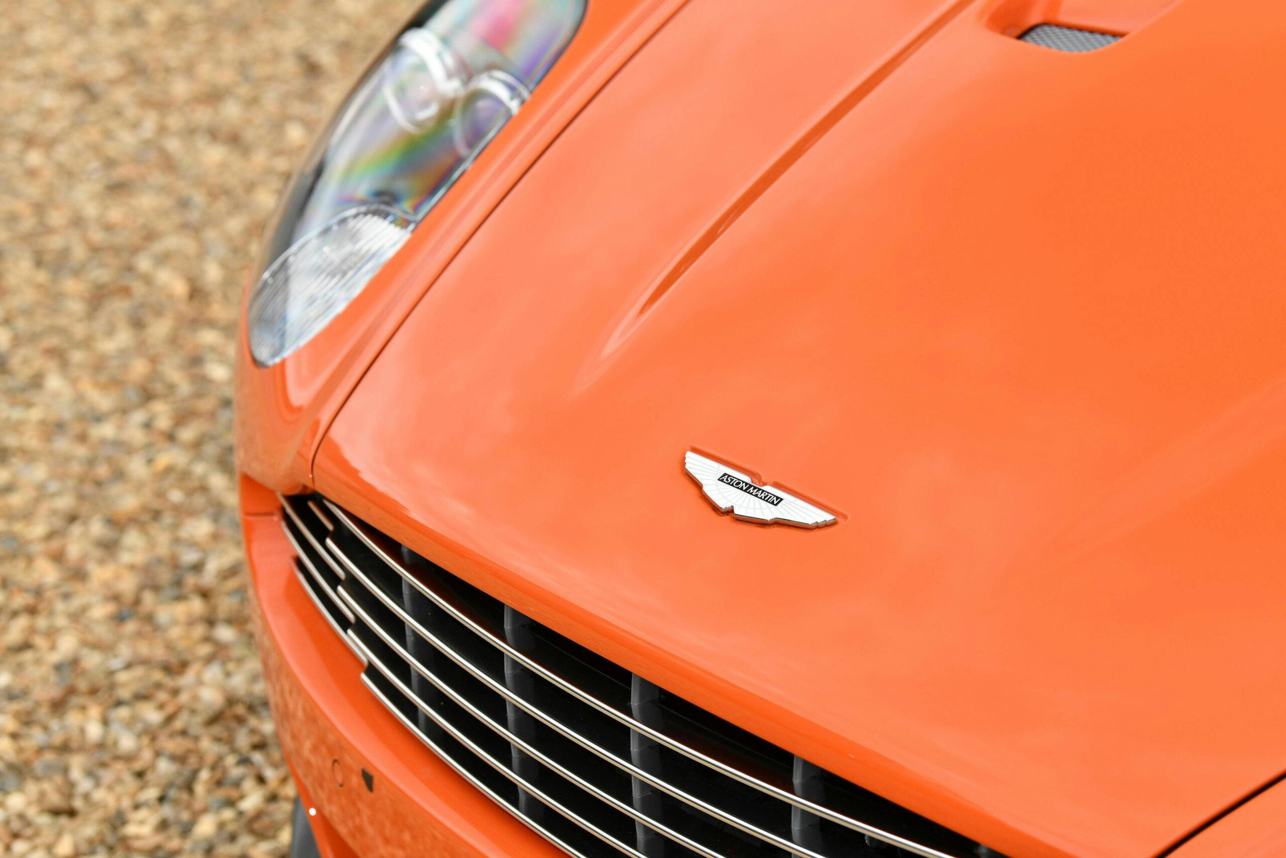 2011-Aston-Martin-DBS-Volante orange hood emblem