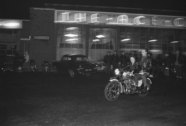 Motorbikes and riders gather at the Ace Cafe.