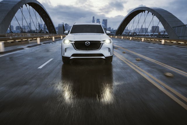 2024 Mazda CX90 front driving action wet road