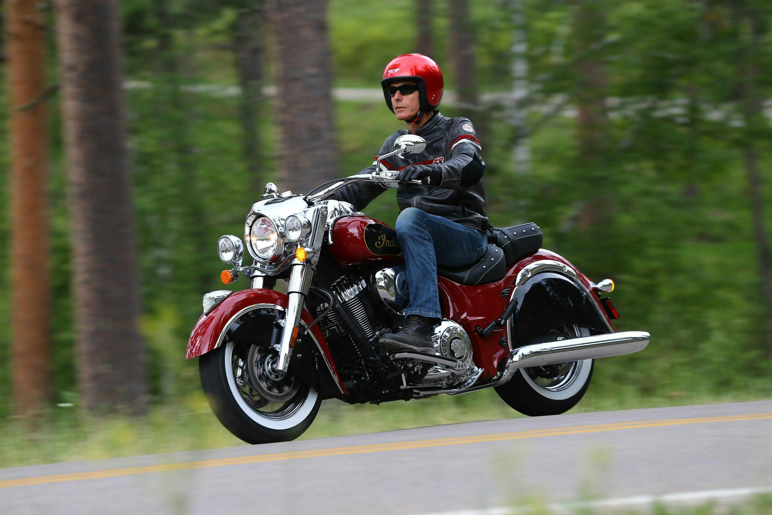 Indian Chief motorcycle cruiser front three quarter riding action