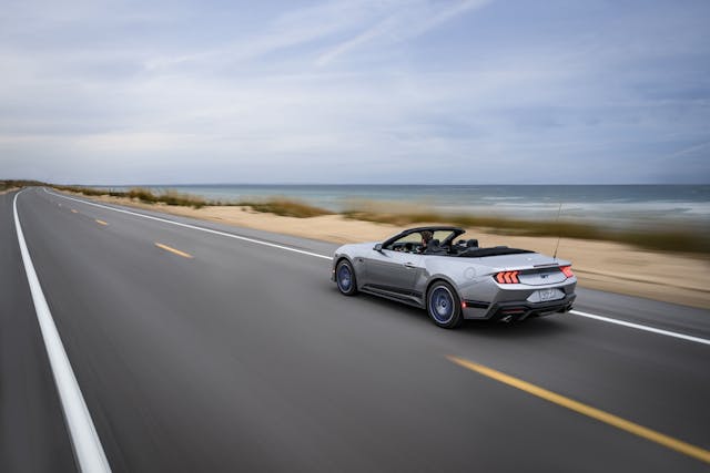 2024 Ford Mustang GT California Special exterior rear three quarter convertible driving by sea