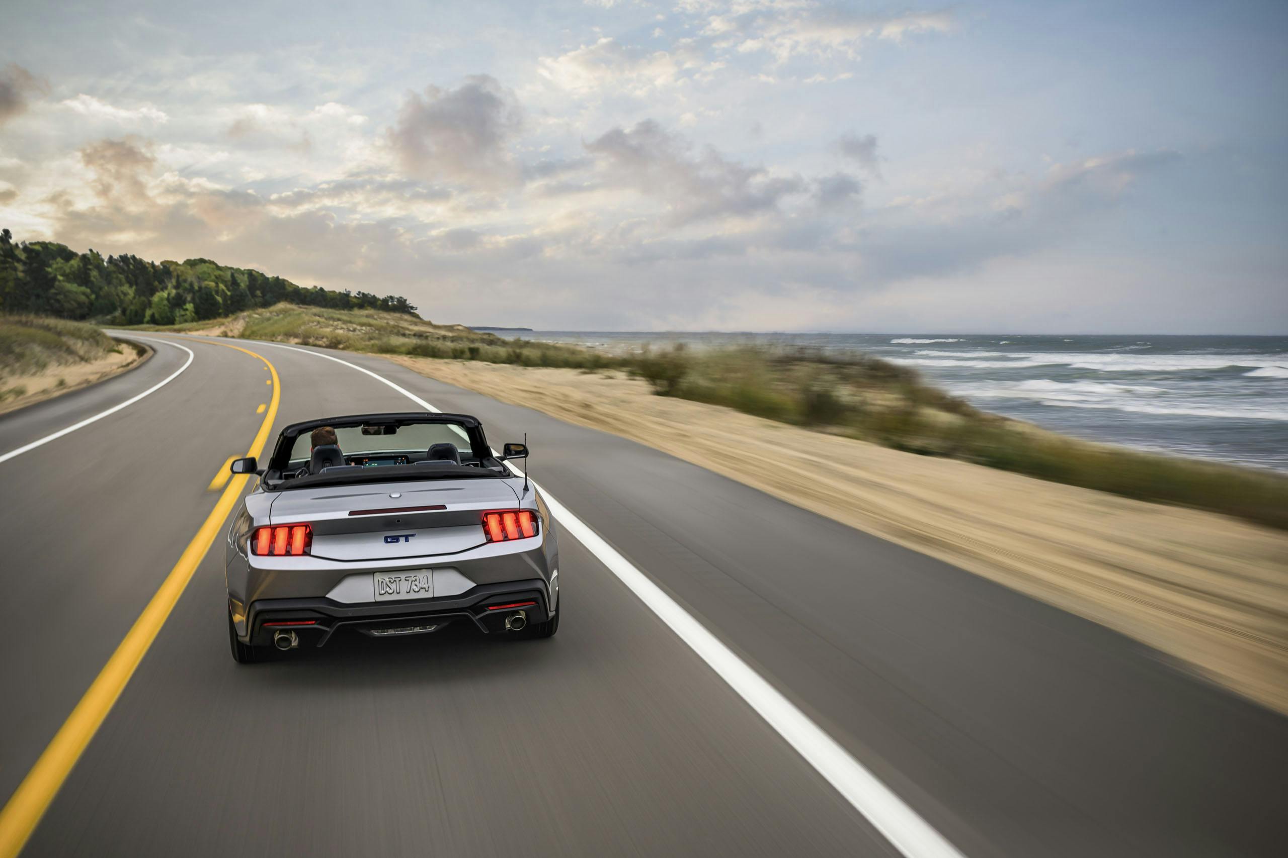 2024 Ford Mustang GT California Special exterior rear end convertible driving by sea